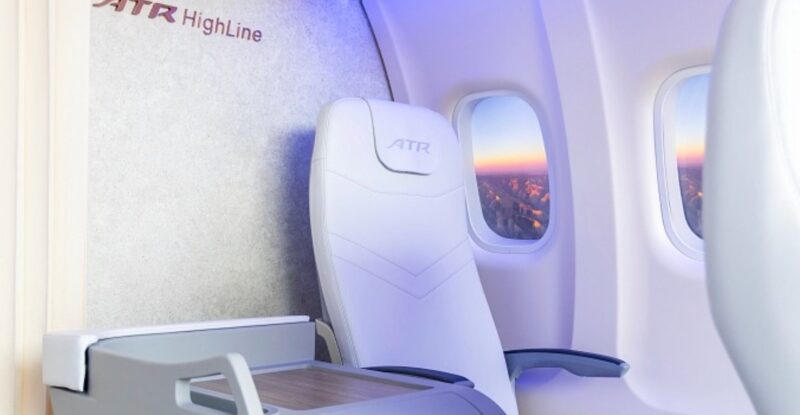 Rendering shows X-Space Table plug-and-play solution that allows airlines to convert seat duos into premium seats, with the aisle-side seat’s back and pan removed and replaced with a side table