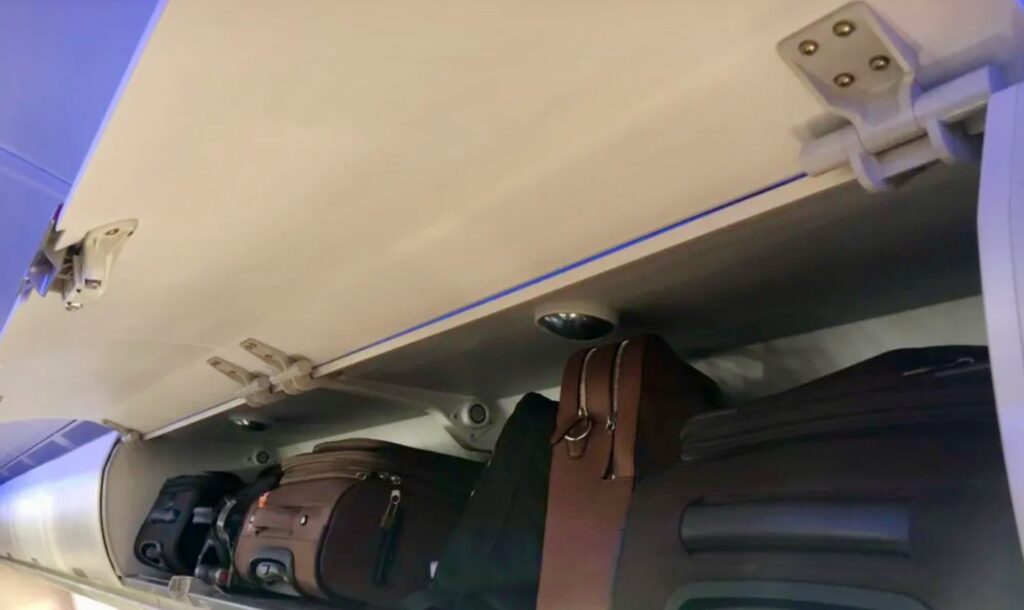 Airbus Airspace cabin on an A330neo; this image shows the large overhead bins and purple mood lighing