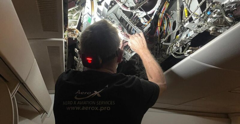 Vallair and AeroX employee installing Starlink on an aircraft.