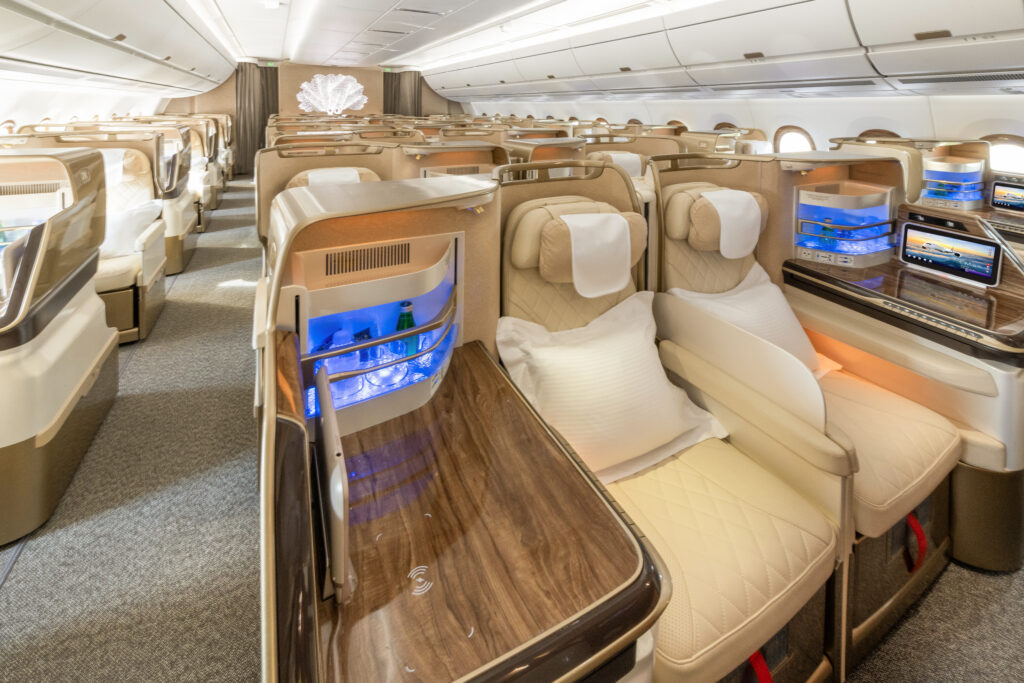 Emirates' A350 Business Class Cabin is filled with creams and faux wood finishes.