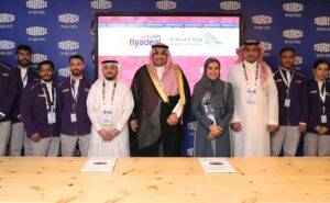 Flanked by flyadeal cabin crew at the official launch of the airline’s tour guide initiative at the TOURISE Summit in Riyadh are, from fifth left: Mohammed Mudhish, flyadeal Chief People Officer; Abdulmohsen Almazid, Undersecretary of the Ministry of Tourism Saudi Arabia for Licenses and Classification; Nada Al-Tamimi, Assistant Deputy Minister of National Affairs at the Ministry; and Abdulaziz Alsaeedi, the Ministry’s General Manager of Tourism Licensing.