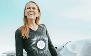 Christine Hannon standing next to an aircraft.