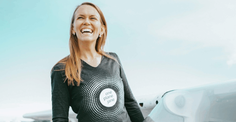 Christine Hannon standing next to an aircraft.