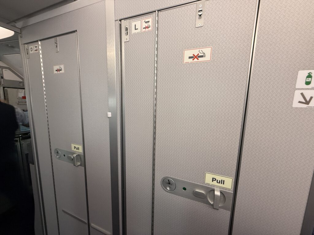 Lavatory doors are closed on the aircraft.