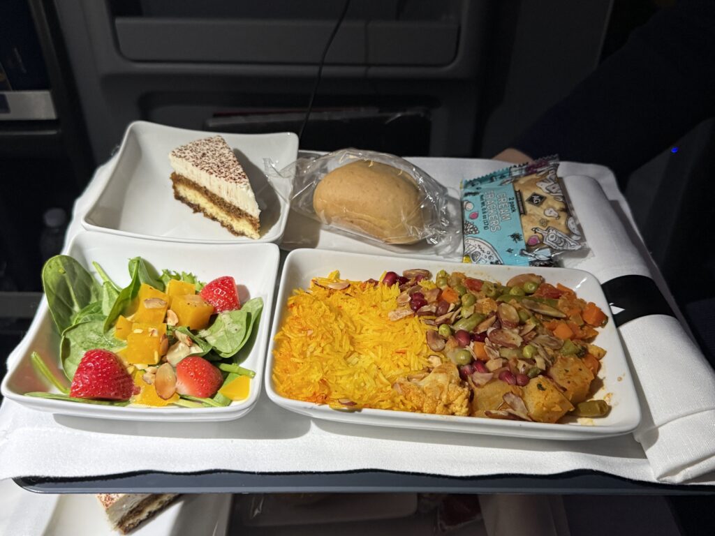 Cauliflower biryani with salad and desert.