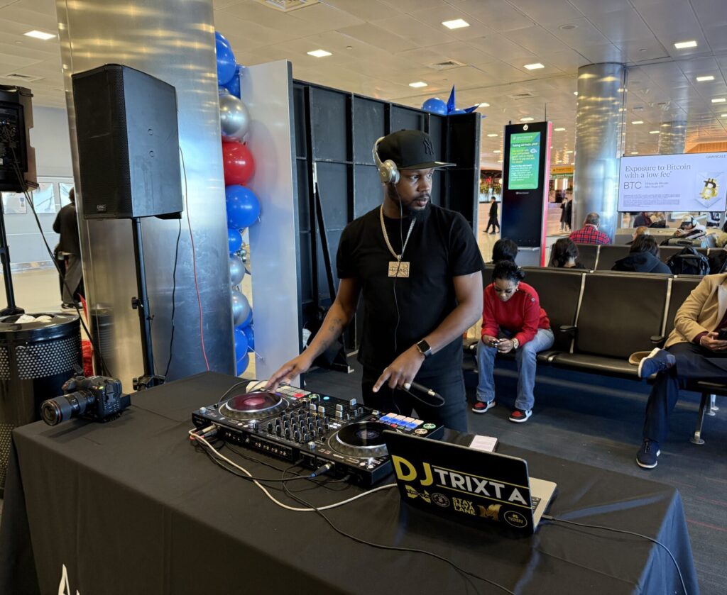 A DJ is playing during the inaugural American Airlines A321XLR event at JFK.