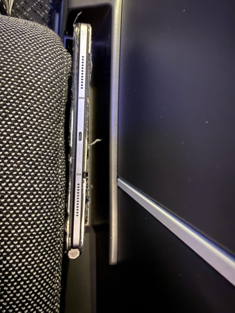 A laptop is stored in the convenient storage provided in the suite. 