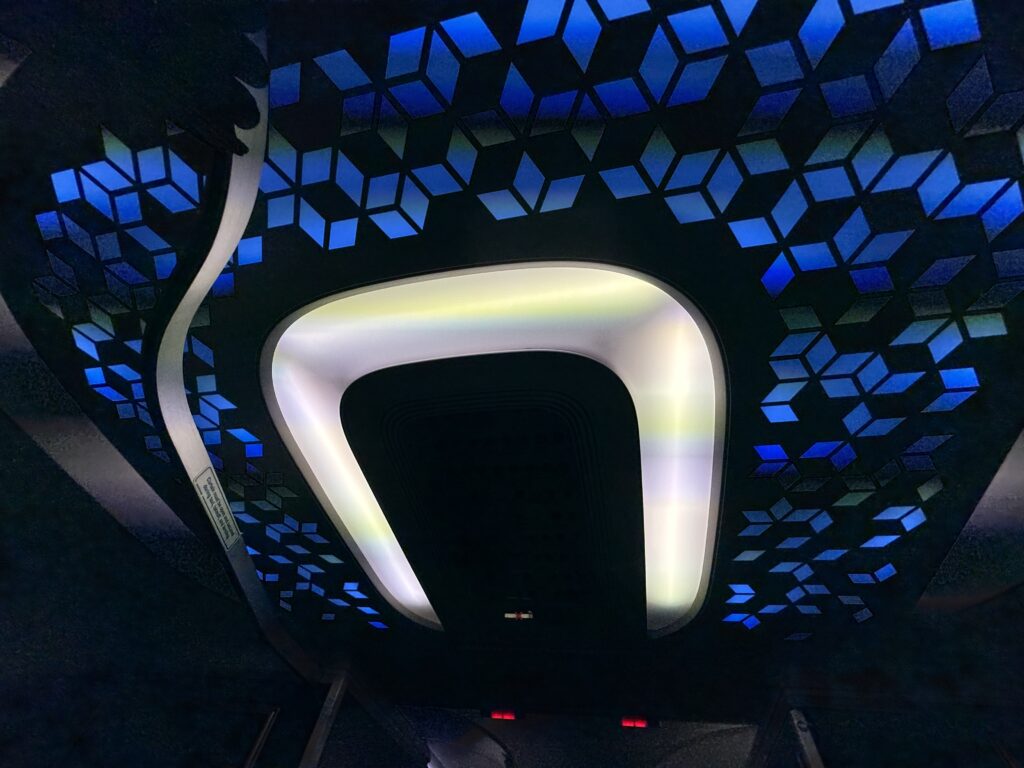 Blue and black mosaic style lighting in the aircraft. 
