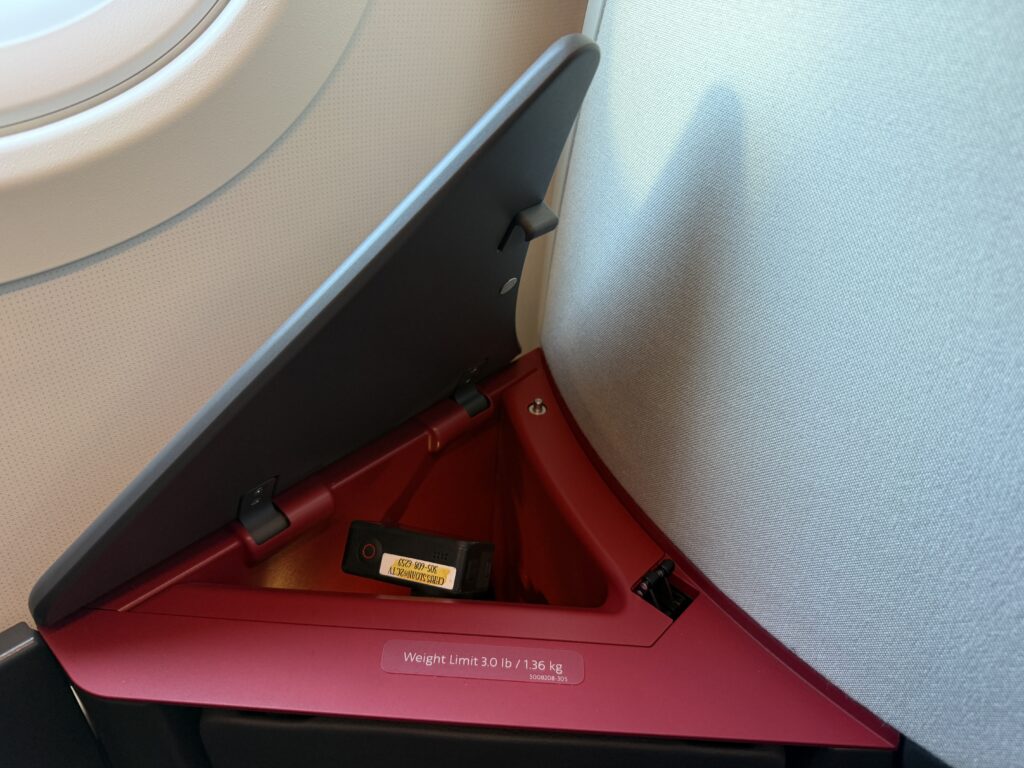 A pop of red in the storage area of the suite. 