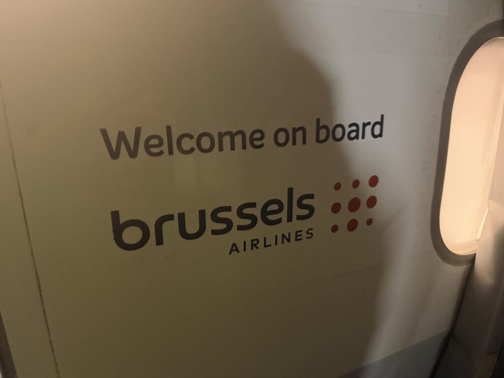 "Welcome on board Brussels Airlines" is seen on the side of the A320 aircraft as passengers enter.