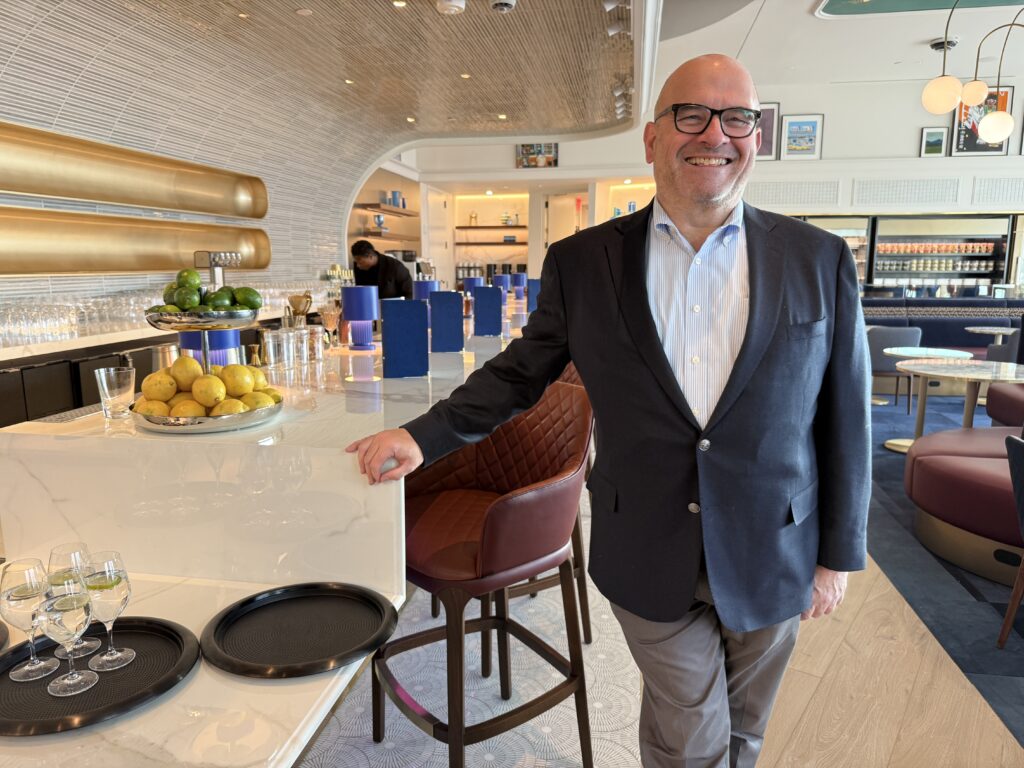 JetBlue president Marty St. George standing at the bar of the new lounge in JFK.