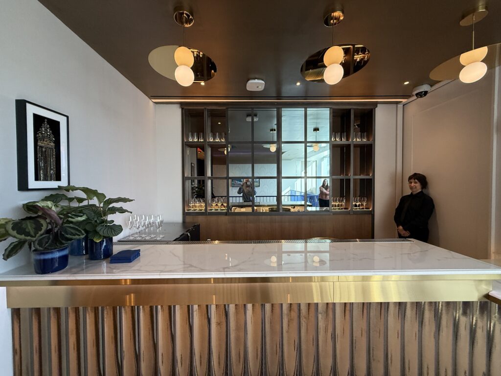Mirrored panels behind the bar on the upstairs level of the BlueHouse lounge.