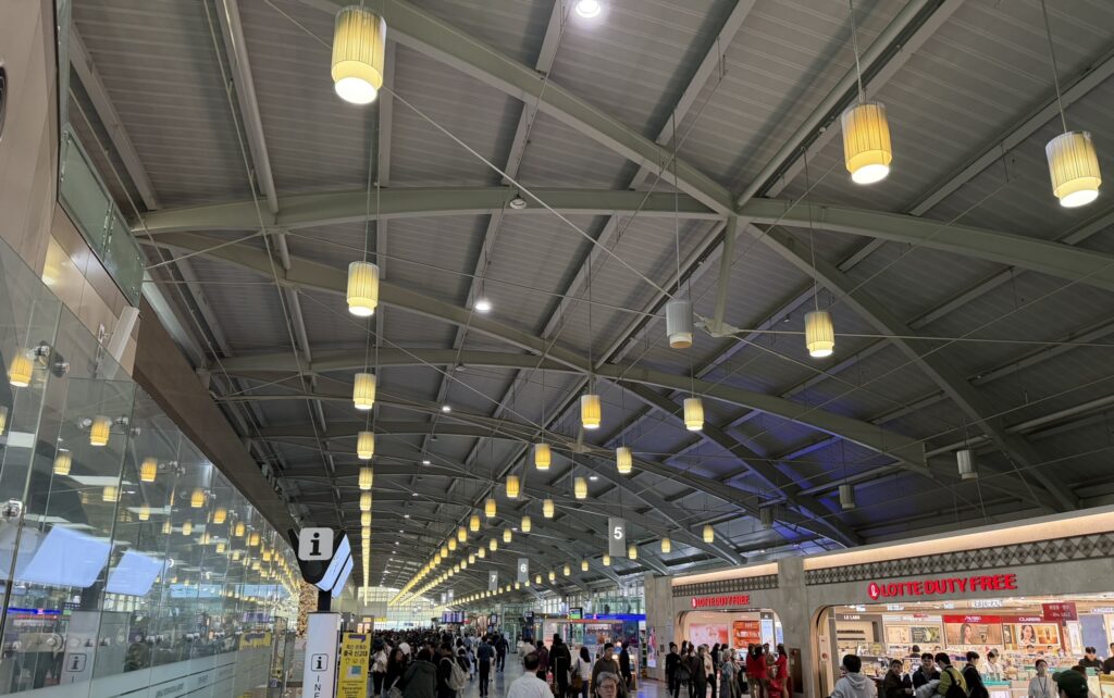 Busan’s international terminal is crowded with passengers.