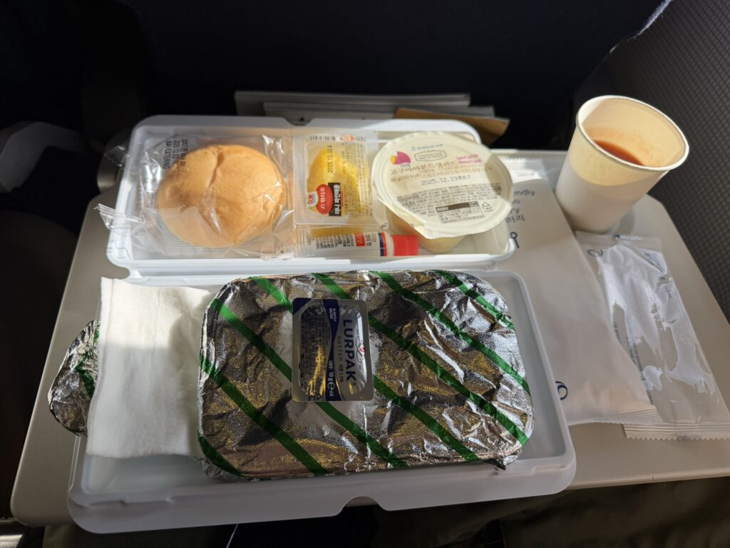 A full wrapped meal is served to passengers during a Korean Air flight.