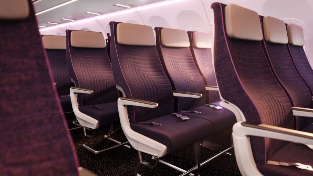 Sleek Recaro R3 economy class seats in rich purples on the Thai Airways aircraft.