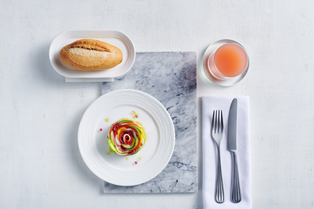 Emirates vegan cuisine in the sky - Heirloom tomato, pear, mango salad.