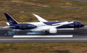 Lufthansa aircraft in blue and white livery with "1926-2026" on the side.