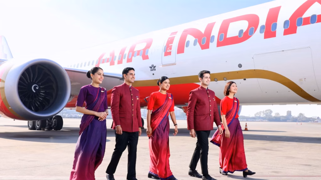 Air India crew members walking towards the new aircraft.