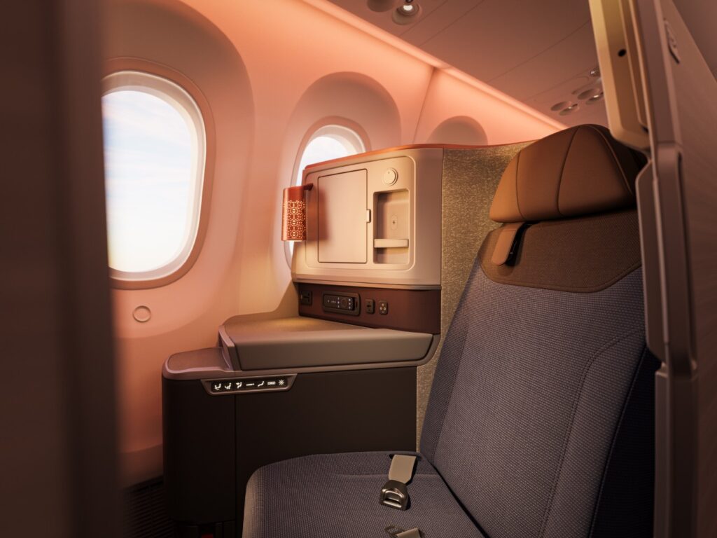 Window seat in business class, with soft mood lighting casting a pretty glow