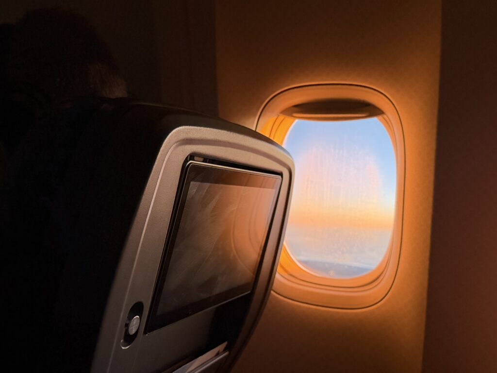 Sun shines through the window of the 777 en route to London