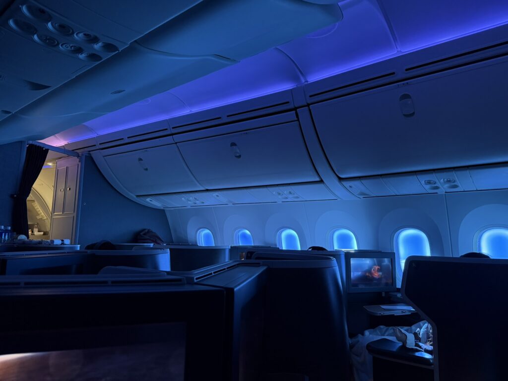 Blue mood lighting in the business class cabin aboard the 787-9