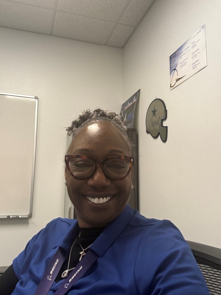 Cheryl Carter poses for a selfie at work