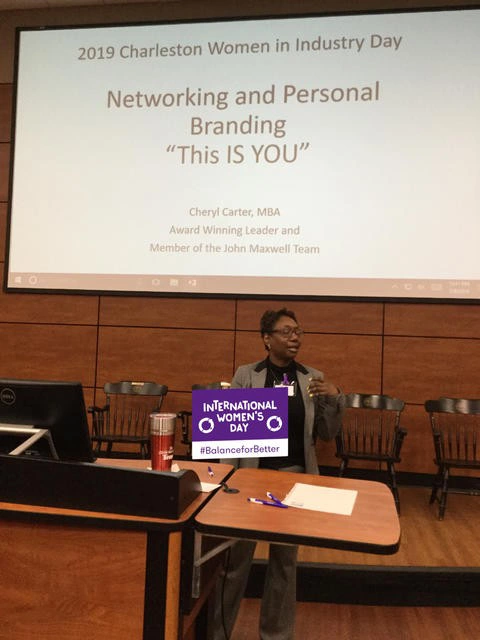 Cheryl is seen speaking at a Women in Industry Day event.