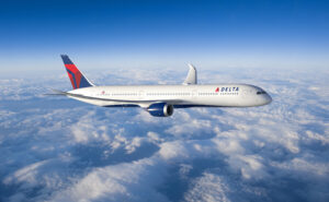 Delta Air Lines Boeing 787 Dreamliner in flight above the clouds.