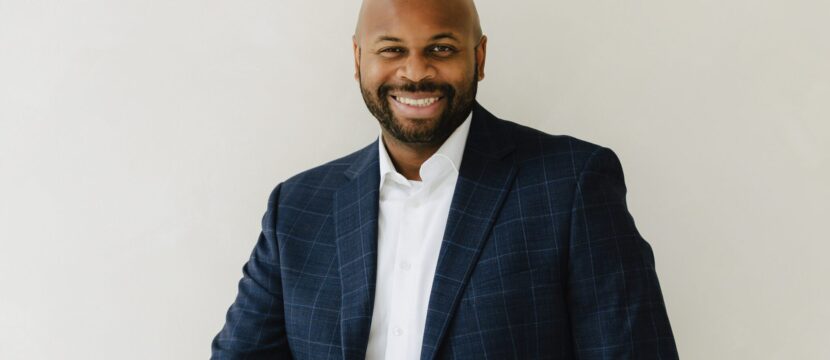 Bradley Akubuiro is a Partner at Bully Pulpit International and posing here for a photo.