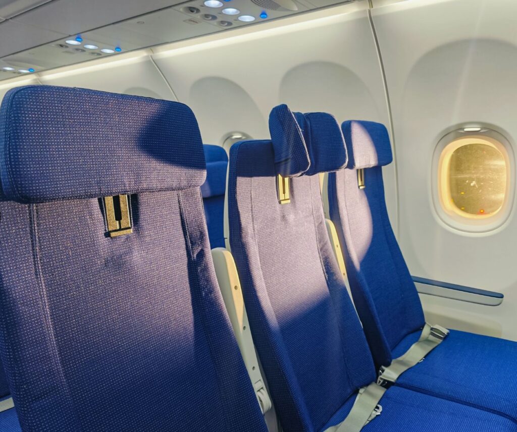 Close up of seat covers on the slimline seats in economy class