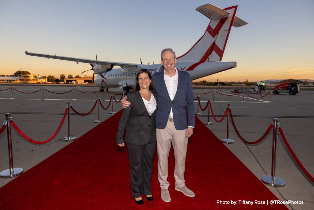 The CEOs of both ATR and JSX stand on a red carpet in front of JSX's first 30-seat ATR 42-600 turboprop