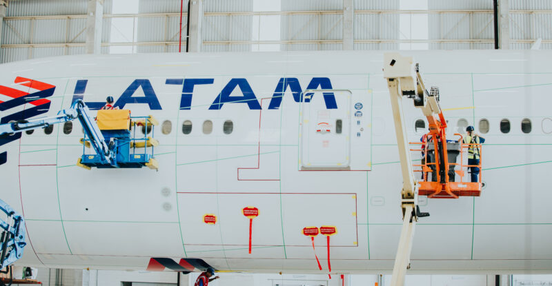 Lufthansa Technik technicians apply AeroSHARK to LATAM 777