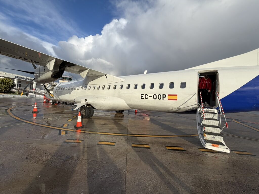 An Iberia ATR 72, registered EC-OOP, is ready for boarding at Malaga Airport.