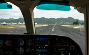 Looking out towards the runway from the cockpit window.