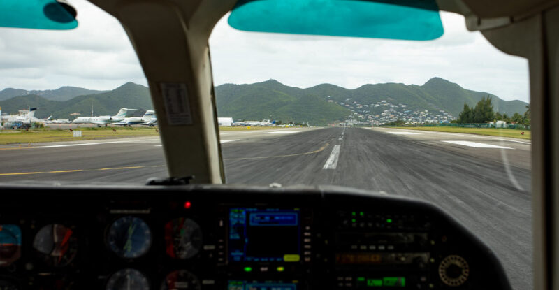 Looking out towards the runway from the cockpit window.