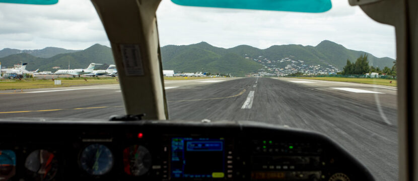 Looking out towards the runway from the cockpit window.