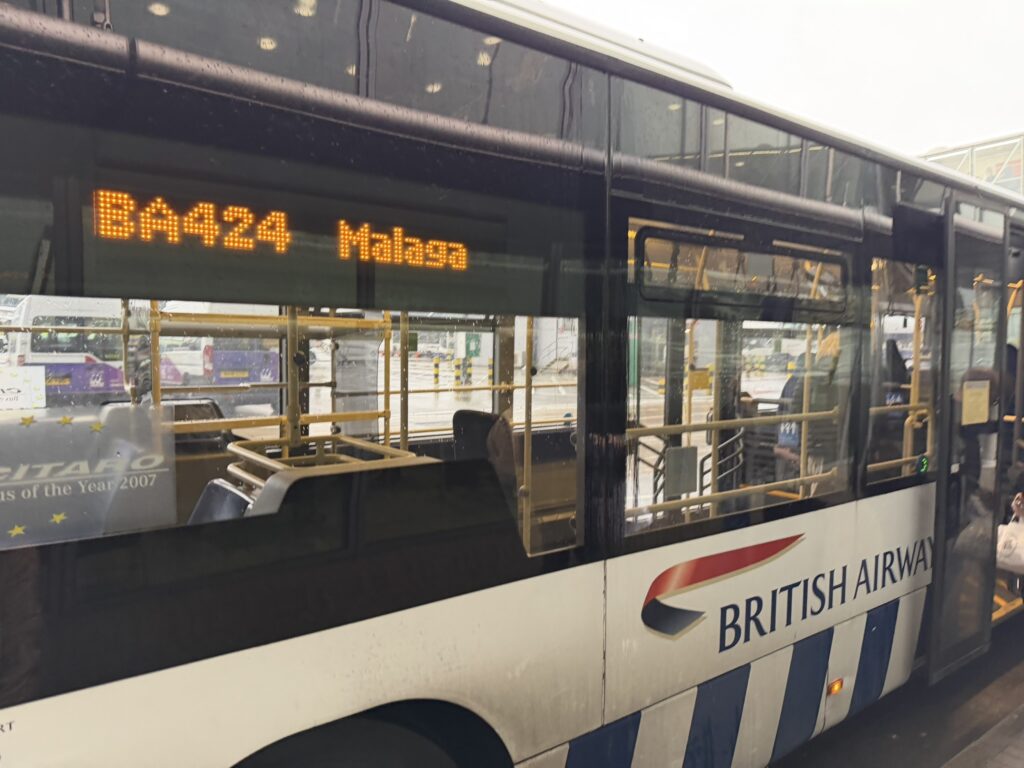 A bus indicating that it is going to the aircraft that will operate the Malaga flight. 