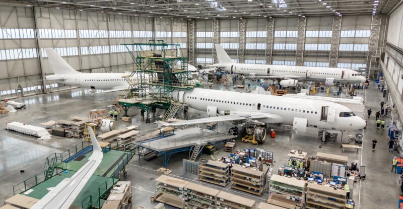 Inside a busy FL Technics hangar.