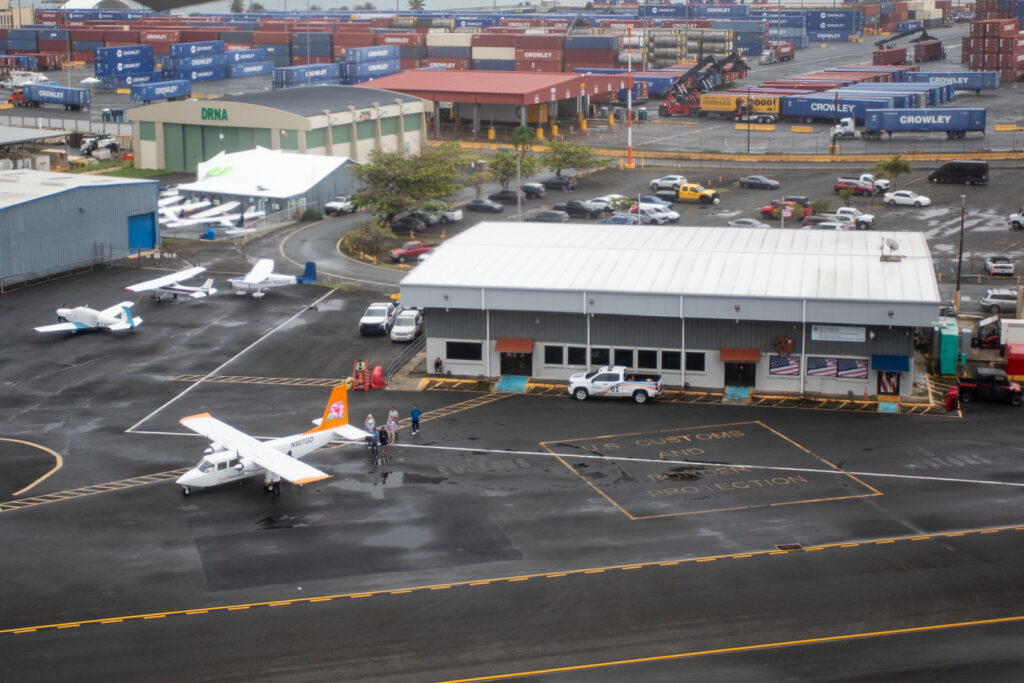 Looking out the aircraft window at the small airport and other VAL aircraft ready to take off.