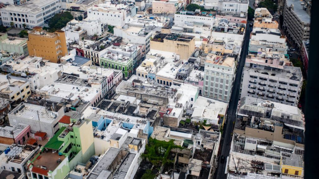 Looking out of the aircraft over a city view.