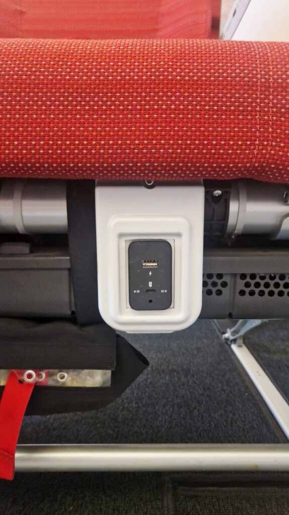 WeSky USB port under an economy class seat.