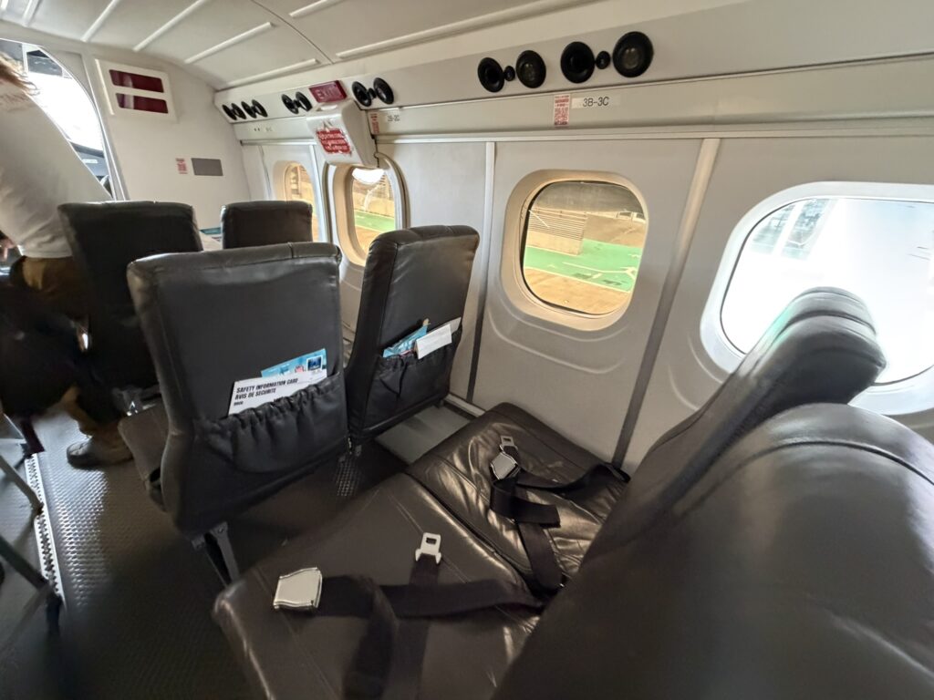 Inside the cabin of the Winair Twin Otter aircraft in a 1-2 layout.