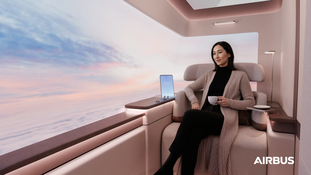 A female passenger is sitting the the Airspace A350 first class suite. 