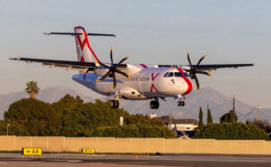 JSX ATR 42-600 landing at an airport.