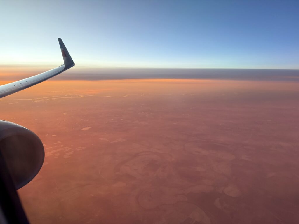 Aircraft wing and engine as seen from the cabin window