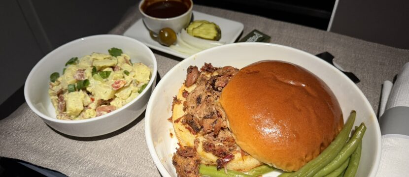Pecan Lodge smoked chopped brisket sandwich with sides.