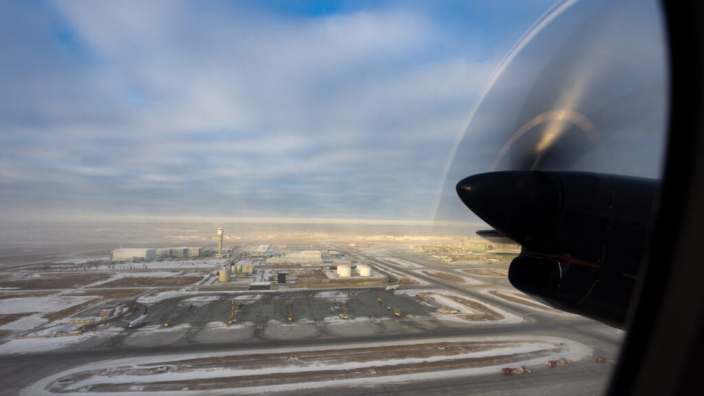 Looking out the CMA aircraft window to see the propeller. 