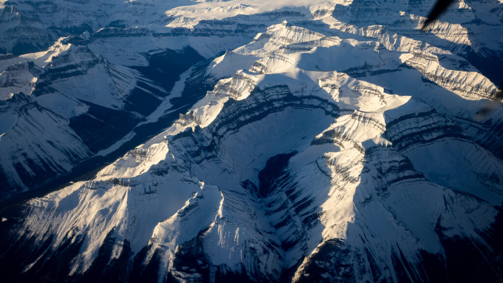 A view of snow covered mountain as seen from the 328 turboprop