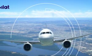 An aircraft flying head on with the Gilat logo in the top left corner.