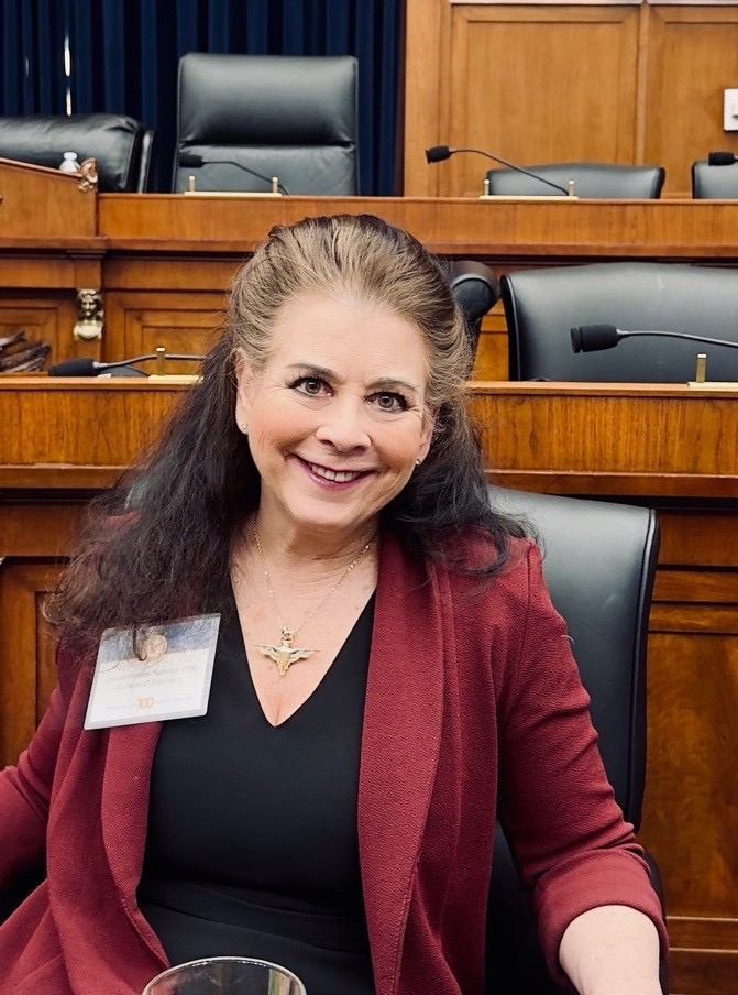Lisa Anderson, now a senior aviation safety leader at the United Nations, is seated.